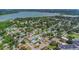 A lovely aerial view of a neighborhood with mature trees and a serene lake in the background at 711 42Nd S Ave, St Petersburg, FL 33705