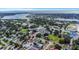An aerial view of the neighborhood, displaying community amenities, lush landscaping, and serene waterfront at 711 42Nd S Ave, St Petersburg, FL 33705