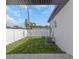Backyard features a grassy area and a white fence at 711 42Nd S Ave, St Petersburg, FL 33705