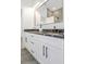 Bathroom featuring double sink with white cabinets and modern black hardware at 711 42Nd S Ave, St Petersburg, FL 33705