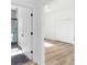 Modern bathroom featuring a glass shower, contrasting dark tile floor, and an adjacent bedroom at 711 42Nd S Ave, St Petersburg, FL 33705