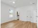 Bright bedroom featuring hardwood floors, modern ceiling fan, and easy access to an ensuite bathroom at 711 42Nd S Ave, St Petersburg, FL 33705