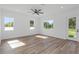 Bright bedroom with hardwood floors, ceiling fan and three windows at 711 42Nd S Ave, St Petersburg, FL 33705