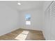 A bright bedroom with wood floors, recessed lights, a bright window, and a closet at 711 42Nd S Ave, St Petersburg, FL 33705
