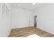 Bedroom boasts wood floors, recessed lights, white walls, a closet and an interior door at 711 42Nd S Ave, St Petersburg, FL 33705