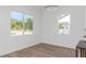 Bright dining area with hardwood floors and large windows at 711 42Nd S Ave, St Petersburg, FL 33705