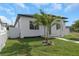 Charming home with white picket fence and lush front yard; a welcoming entrance to a modern design at 711 42Nd S Ave, St Petersburg, FL 33705