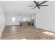 Spacious open floor plan with island, modern kitchen with stainless steel appliances and white cabinets at 711 42Nd S Ave, St Petersburg, FL 33705