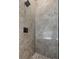 Modern shower featuring marble tiling and black fixtures at 711 42Nd S Ave, St Petersburg, FL 33705