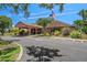 Community clubhouse featuring beautiful landscaping and ample parking for guests at 7433 Greystone Dr # 7433, Hudson, FL 34667