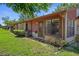 Exterior of the home showcases a well-maintained lawn and private outdoor space at 7433 Greystone Dr # 7433, Hudson, FL 34667