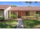Charming single-story home featuring a landscaped yard and inviting front entrance at 7433 Greystone Dr # 7433, Hudson, FL 34667