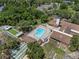 Aerial view of the community pool with surrounding recreation areas and clubhouse at 7433 Greystone Dr # 7433, Hudson, FL 34667