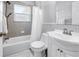 Clean bathroom with a shower-tub combination, a vanity with a sink and a medicine cabinet at 774 40Th Ne Ave, St Petersburg, FL 33703