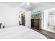 Bright bedroom features hardwood floors, a TV, and access to the kitchen and bathroom at 774 40Th Ne Ave, St Petersburg, FL 33703