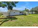 Side view of a cozy single-story home with a lush green lawn at 774 40Th Ne Ave, St Petersburg, FL 33703