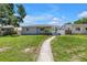 Charming single-story home with a well-manicured lawn and inviting walkway at 774 40Th Ne Ave, St Petersburg, FL 33703