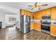 Updated kitchen with stainless steel appliances, wooden cabinets, and a seamless flow into the living area at 774 40Th Ne Ave, St Petersburg, FL 33703