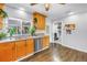 Functional kitchen featuring stainless steel appliances, wooden cabinetry and garden window, plus laundry room access at 774 40Th Ne Ave, St Petersburg, FL 33703