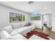 Bright living room featuring a TV and comfortable seating at 774 40Th Ne Ave, St Petersburg, FL 33703