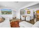 Bright living room flows into dining area with a neutral color palette and modern furnishings at 774 40Th Ne Ave, St Petersburg, FL 33703