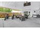 Covered patio features outdoor furniture, a TV, ceiling fans, and a motorcycle for enjoyment at 774 40Th Ne Ave, St Petersburg, FL 33703