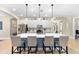 Bright kitchen features stainless steel appliances, a large center island, and pendant lighting at 8840 Mugnai St, Riverview, FL 33578