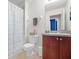 Bathroom featuring tile floors, sink with vanity, toilet and shower with a curtain at 9206 River Rock Ln, Riverview, FL 33578