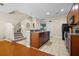An inviting kitchen that opens to the staircase, featuring an eat-in bar, and modern appliances at 9206 River Rock Ln, Riverview, FL 33578