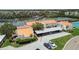 Aerial view showcasing waterfront townhouses, docks, carports, and beautifully maintained landscapes at 4304 Harbor House Dr, Tampa, FL 33615