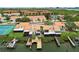 An aerial view shows townhomes with private boat docks offering convenient waterfront living at 4304 Harbor House Dr, Tampa, FL 33615