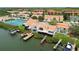 Scenic aerial view of a waterfront townhome, featuring a private boat dock for easy water access at 4304 Harbor House Dr, Tampa, FL 33615