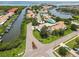 Beautiful aerial view of waterfront community featuring private docks, lush landscaping, and serene water views at 4304 Harbor House Dr, Tampa, FL 33615