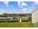 Backyard with manicured shrubs and views of the water and boat docks at 4304 Harbor House Dr, Tampa, FL 33615