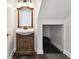 Bathroom with wooden vanity and sink next to an open door leading to a basement at 4304 Harbor House Dr, Tampa, FL 33615