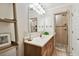This bathroom features a vanity with a wood cabinet, a white sink, and a glass-enclosed shower at 4304 Harbor House Dr, Tampa, FL 33615