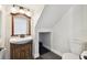 Bathroom with sink, toilet, and doorway to the basement at 4304 Harbor House Dr, Tampa, FL 33615