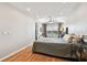 Bright bedroom with hardwood floors, neutral walls, ceiling fan, and a large window for natural light at 4304 Harbor House Dr, Tampa, FL 33615