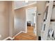 Hallway with hard wood floors with a doorway leading into a living room at 4304 Harbor House Dr, Tampa, FL 33615