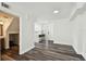Bright living room featuring wood floors and a view to the kitchen and front door at 4304 Harbor House Dr, Tampa, FL 33615
