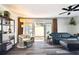 This well-lit living room features a sliding door for accessing outdoor spaces and neutral decor at 4304 Harbor House Dr, Tampa, FL 33615