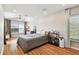 Main bedroom with hardwood floors, ceiling fan, and windows at 4304 Harbor House Dr, Tampa, FL 33615