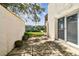 Exterior patio space with sliding doors to the home and views of community marina at 4304 Harbor House Dr, Tampa, FL 33615