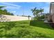 Picture of the large, well maintained, grassy backyard area with white fencing and views of the pool at 10101 Paddock Oaks Dr, Riverview, FL 33569