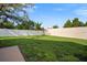 Expansive backyard with healthy green grass and a sturdy white privacy fence at 10101 Paddock Oaks Dr, Riverview, FL 33569