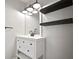 Well-lit vanity with sleek black hardware, a stylish mirror, and ample counter space provides comfort and style at 10101 Paddock Oaks Dr, Riverview, FL 33569