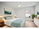 Bright bedroom features a queen bed, stylish décor, and a cozy atmosphere that is relaxing at 10101 Paddock Oaks Dr, Riverview, FL 33569