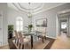Dining room featuring a glass table, pendant lighting and views of the outdoor scenery at 10101 Paddock Oaks Dr, Riverview, FL 33569