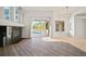 Living room featuring wood flooring, fireplace, and view of pool at 10101 Paddock Oaks Dr, Riverview, FL 33569