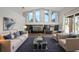 Spacious living room with high ceilings, large windows, and a cozy seating area perfect for relaxation at 10101 Paddock Oaks Dr, Riverview, FL 33569